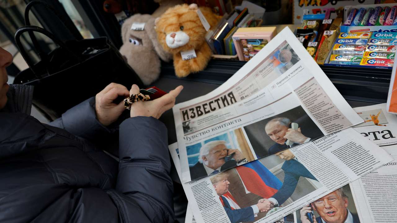 View of newspaper covers dedicated to Putin-Trump phone call at newsstand in Moscow