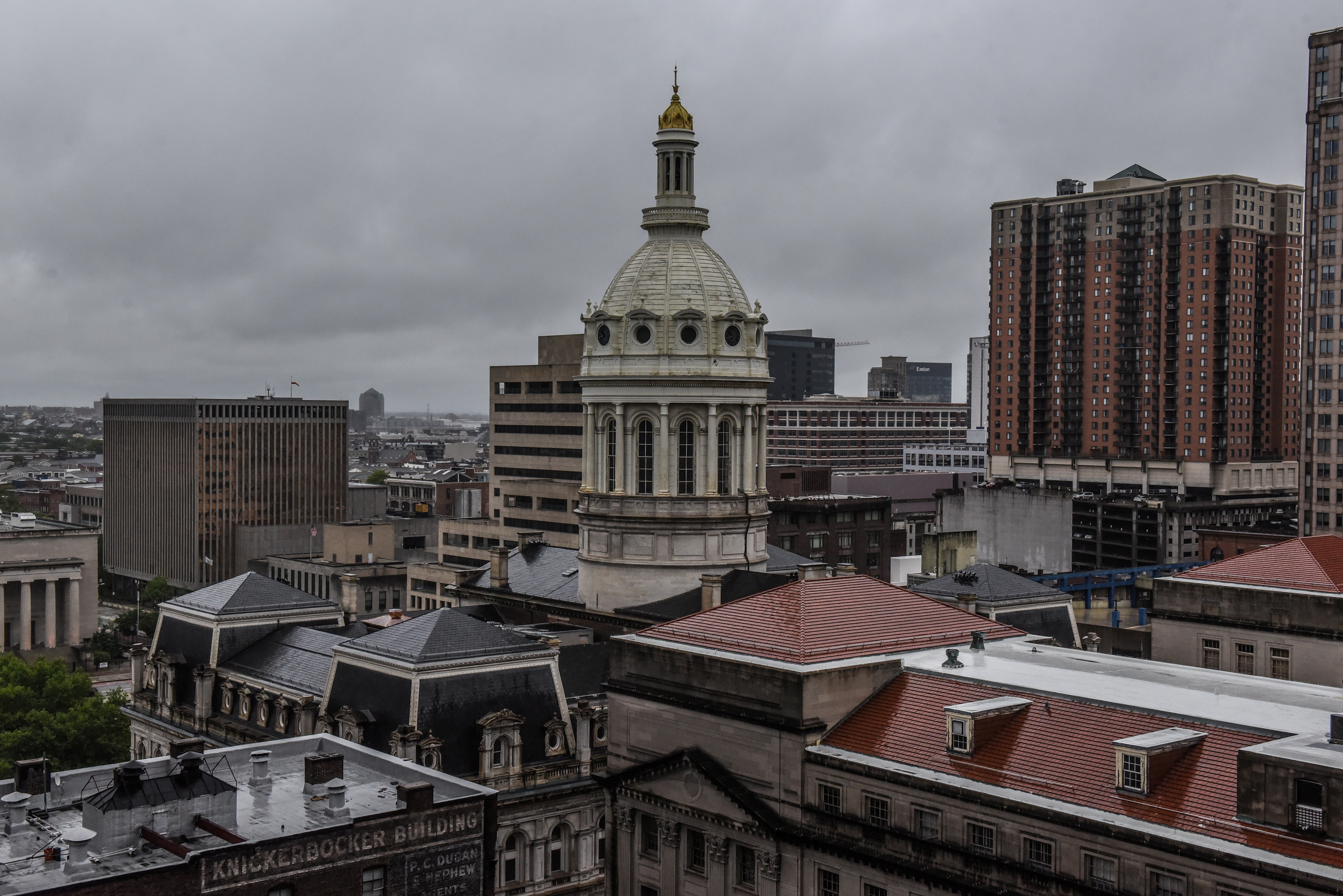 The cupola of Baltimore City Hall is seen amidst the skyline in Baltimore, Maryland