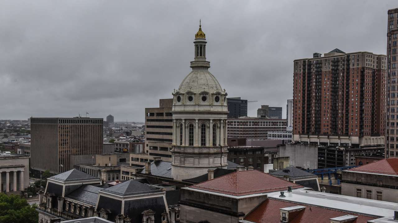 The cupola of Baltimore City Hall is seen amidst the skyline in Baltimore, Maryland