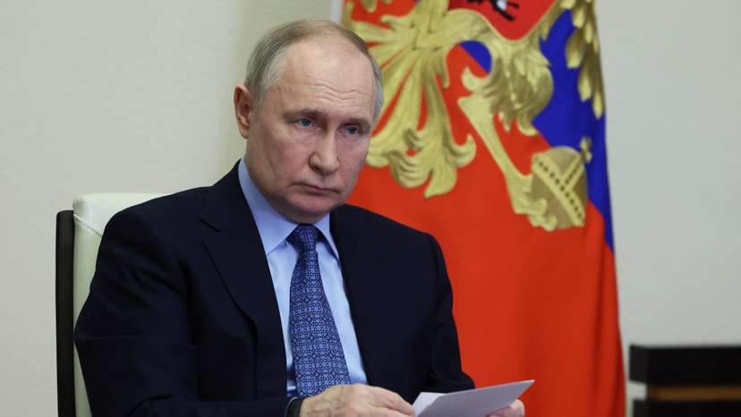 FILE PHOTO: Russian President Putin chairs a meeting via video link at a residence outside Moscow
