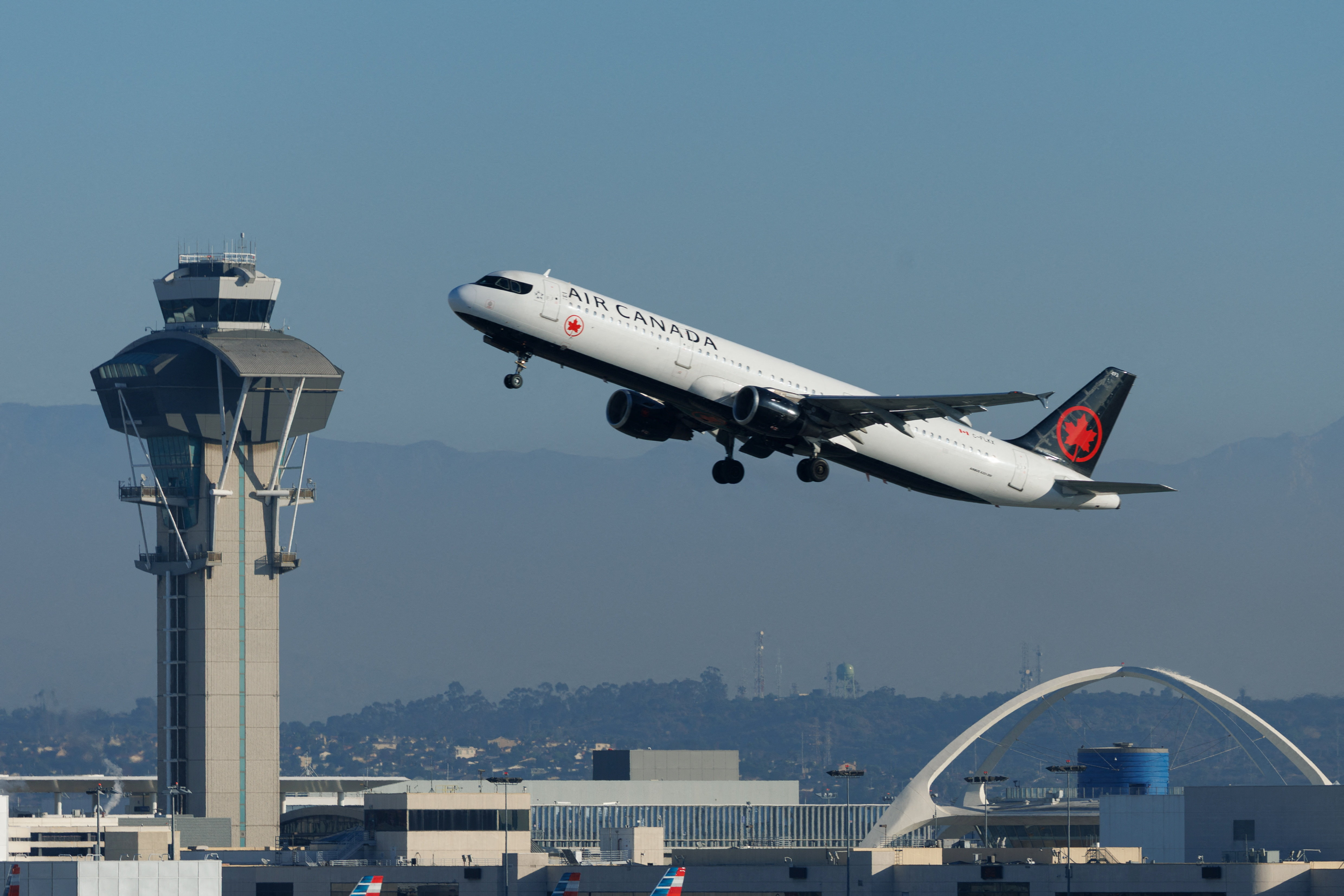 Commercial airliners take-off from Los Angeles International Airport