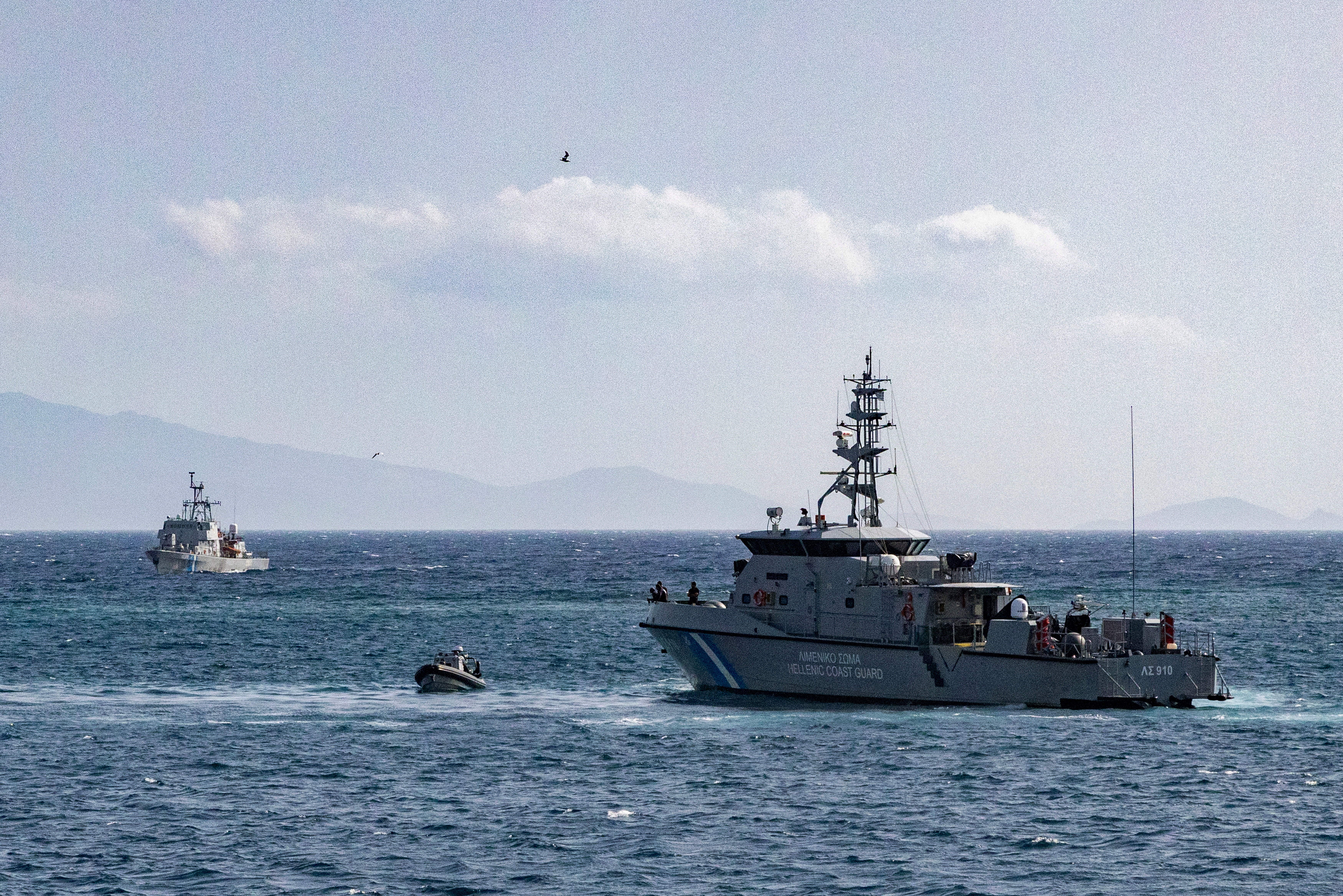 Two Hellenic Coast Guard vessels, supported by a patrol boat, conduct Search and Rescue (SAR) operations in search of the migrants missing following a shipwreck, off Lesbos Island
