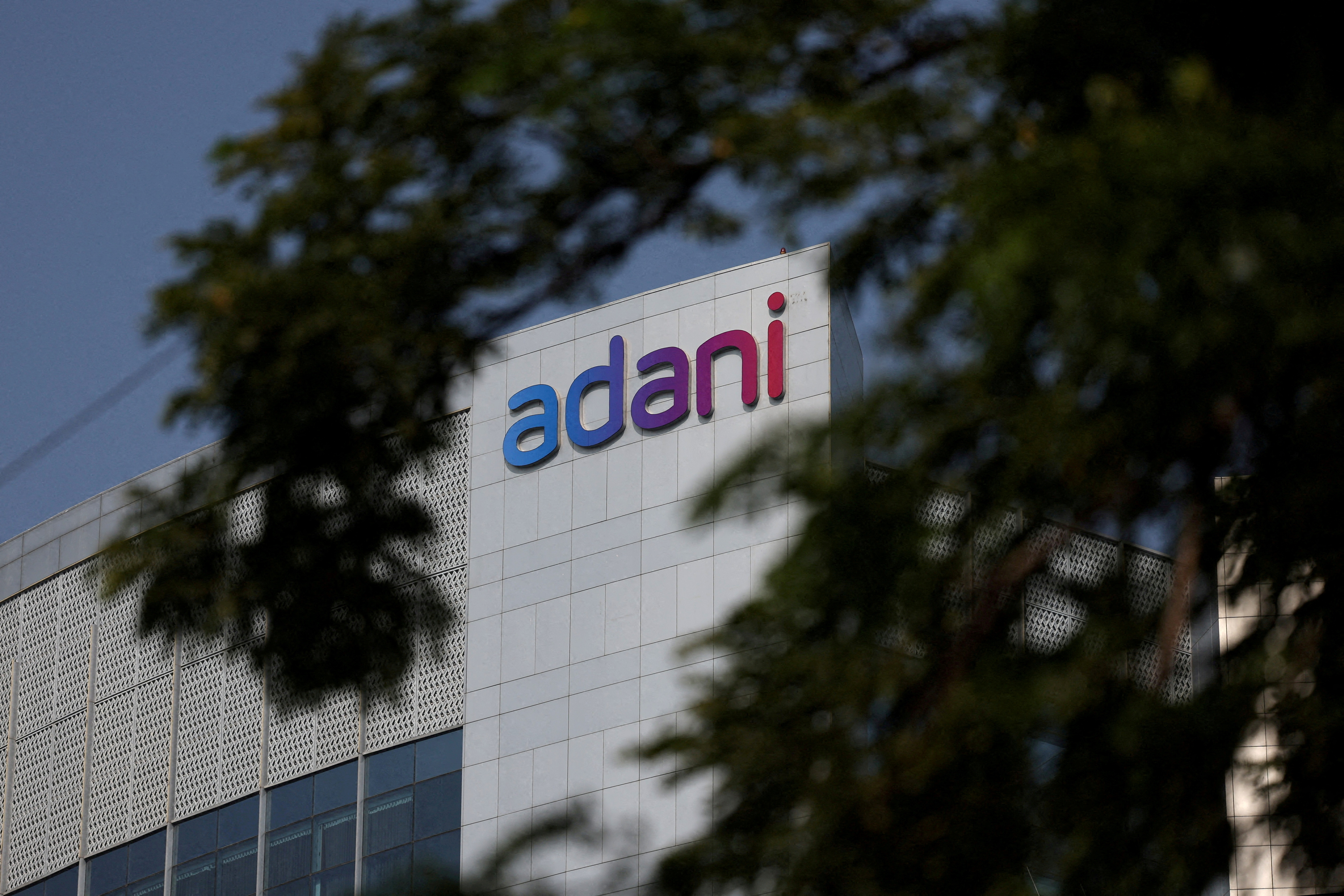 FILE PHOTO: The logo of the Adani Group is seen on the facade of its Corporate House on the outskirts of Ahmedabad