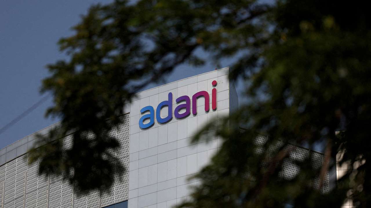 FILE PHOTO: The logo of the Adani Group is seen on the facade of its Corporate House on the outskirts of Ahmedabad