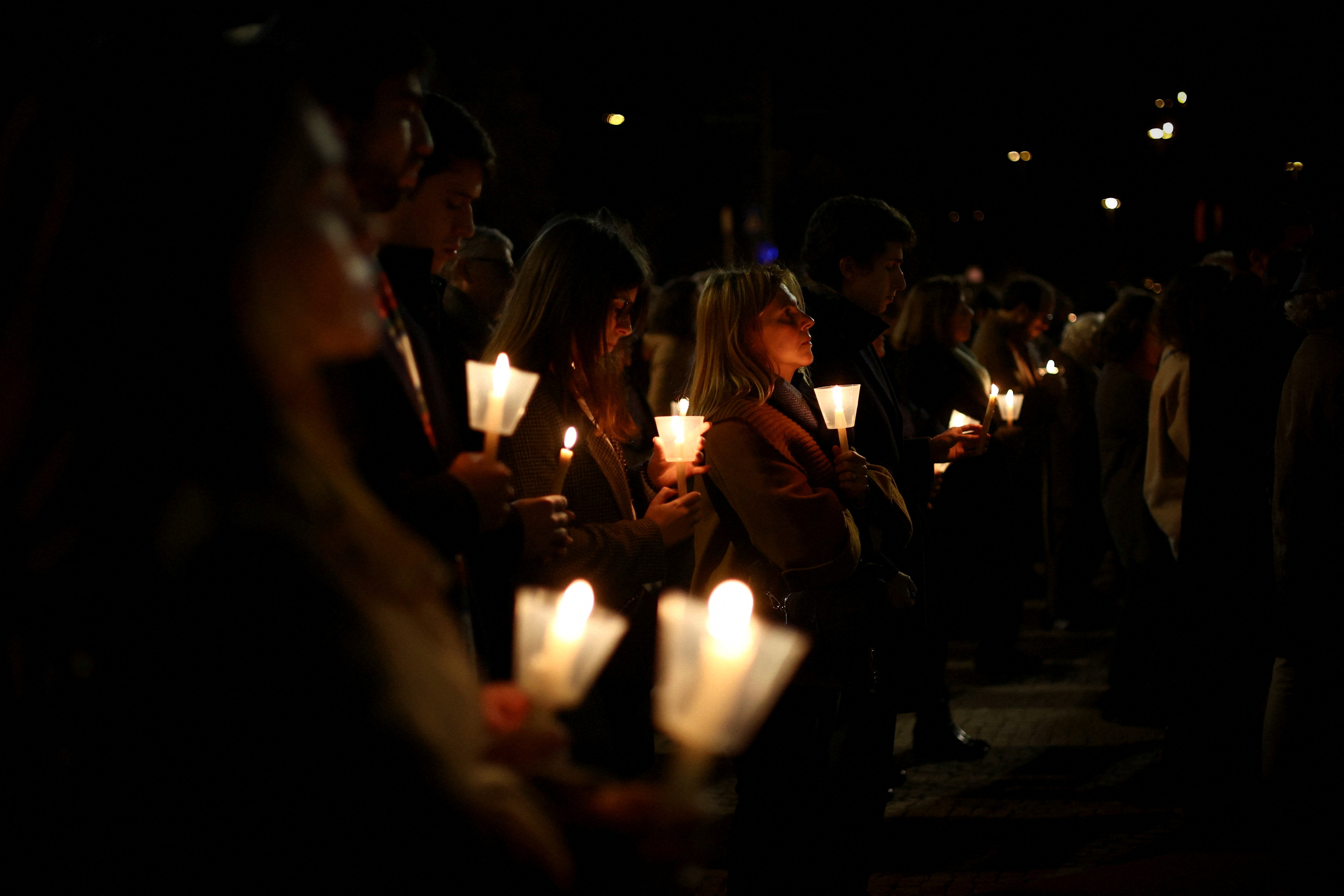 FILE PHOTO: People participate in a vigil in support of the 4,815 children that were sexually abused by members of the Portuguese Catholic Church, according to the commission investigating the issue, in Lisbon