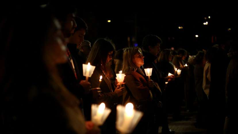 FILE PHOTO: People participate in a vigil in support of the 4,815 children that were sexually abused by members of the Portuguese Catholic Church, according to the commission investigating the issue, in Lisbon