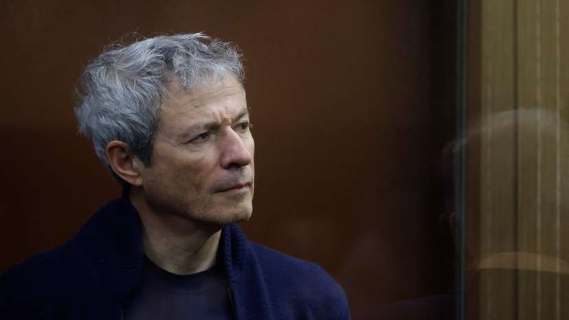Vadim Moshkovich, founder of the country's top agriculture company Rusagro, stands inside a defendants' cage during a court hearing in Moscow