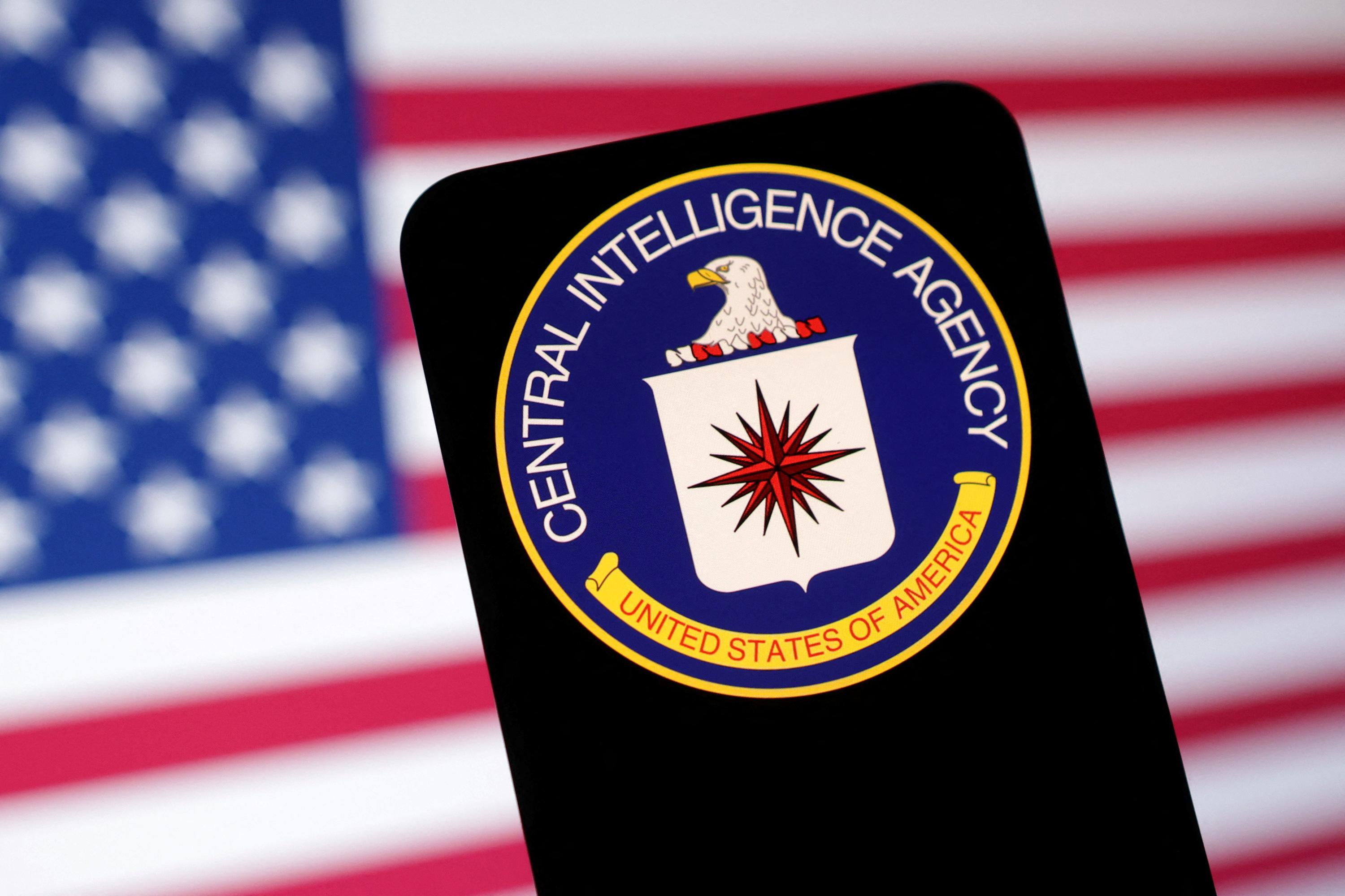 Illustration shows CIA (Central Intelligence Agency) logo and U.S. flag