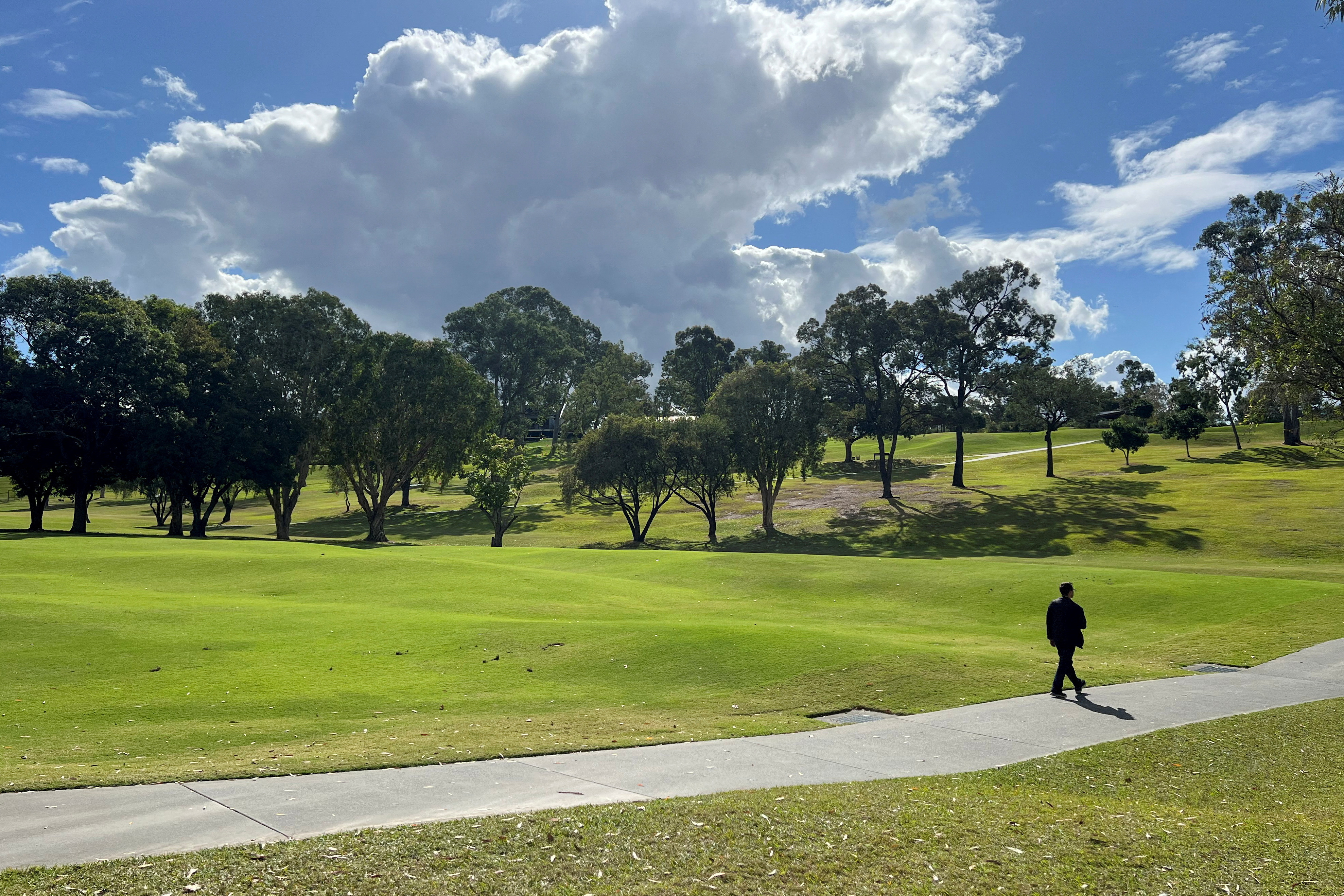 FILE PHOTO: A man walks at the Victoria Park-Barrambin, in Brisbane