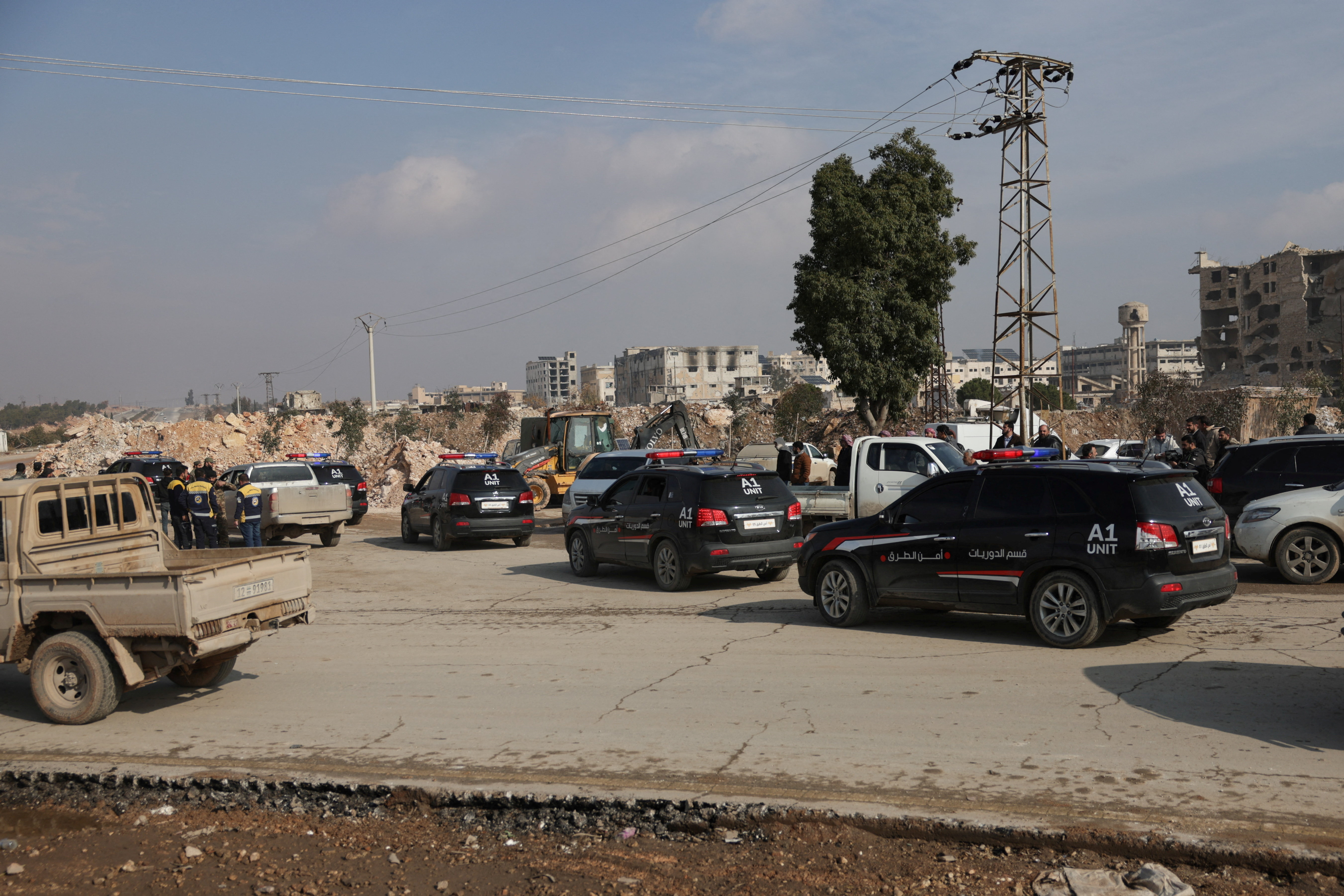 Syrian Democratic Forces (SDF) depart on buses, following an agreement with the Syrian government, in Aleppo