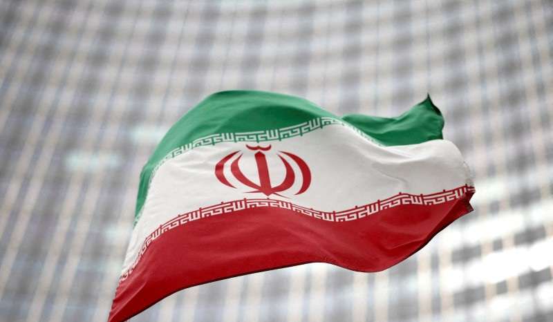 FILE PHOTO: Iranian flag flies in front of the UN office building in Vienna