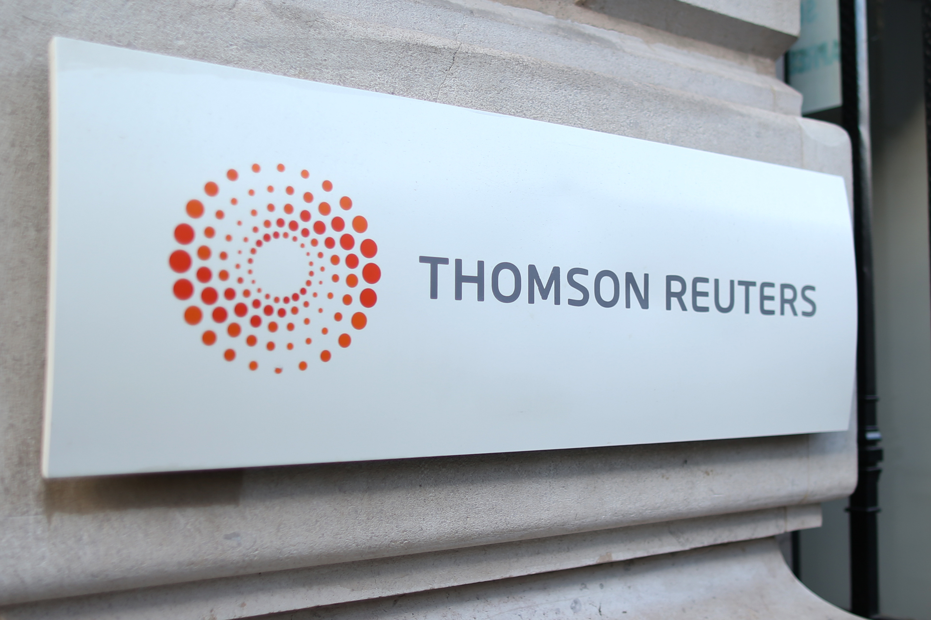 The logo of Thomson Reuters is pictured at the entrance of its Paris headquarters, France