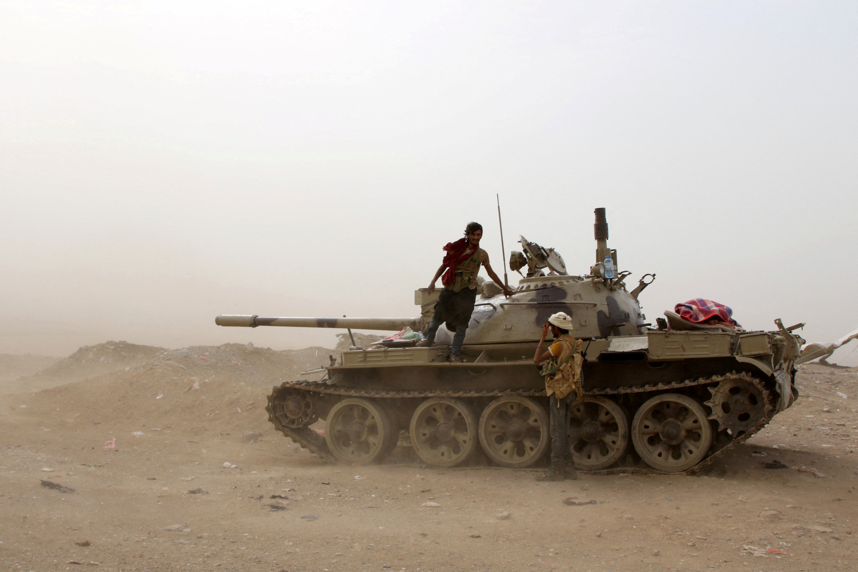 FILE PHOTO: Members of UAE-backed southern Yemeni separatist forces stand by a tank during clashes with government forces in Aden
