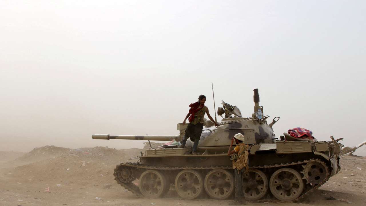 FILE PHOTO: Members of UAE-backed southern Yemeni separatist forces stand by a tank during clashes with government forces in Aden
