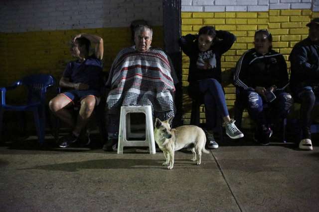 Venezuelans wait outside closed voting station to vote in presidential election, in Las Vegas de Tariba