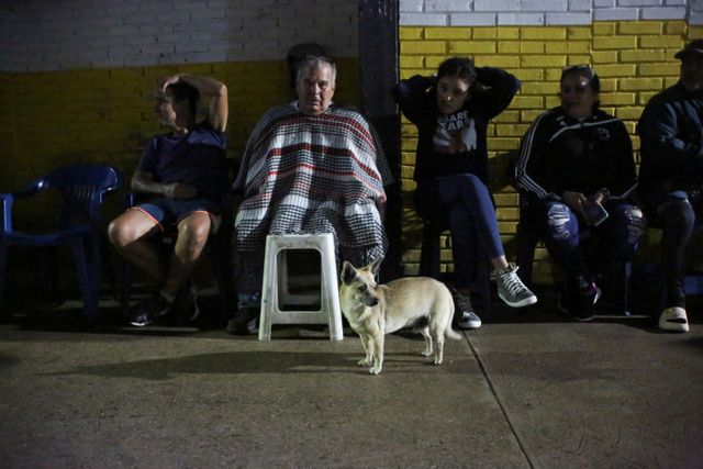 Venezuelans wait outside closed voting station to vote in presidential election, in Las Vegas de Tariba