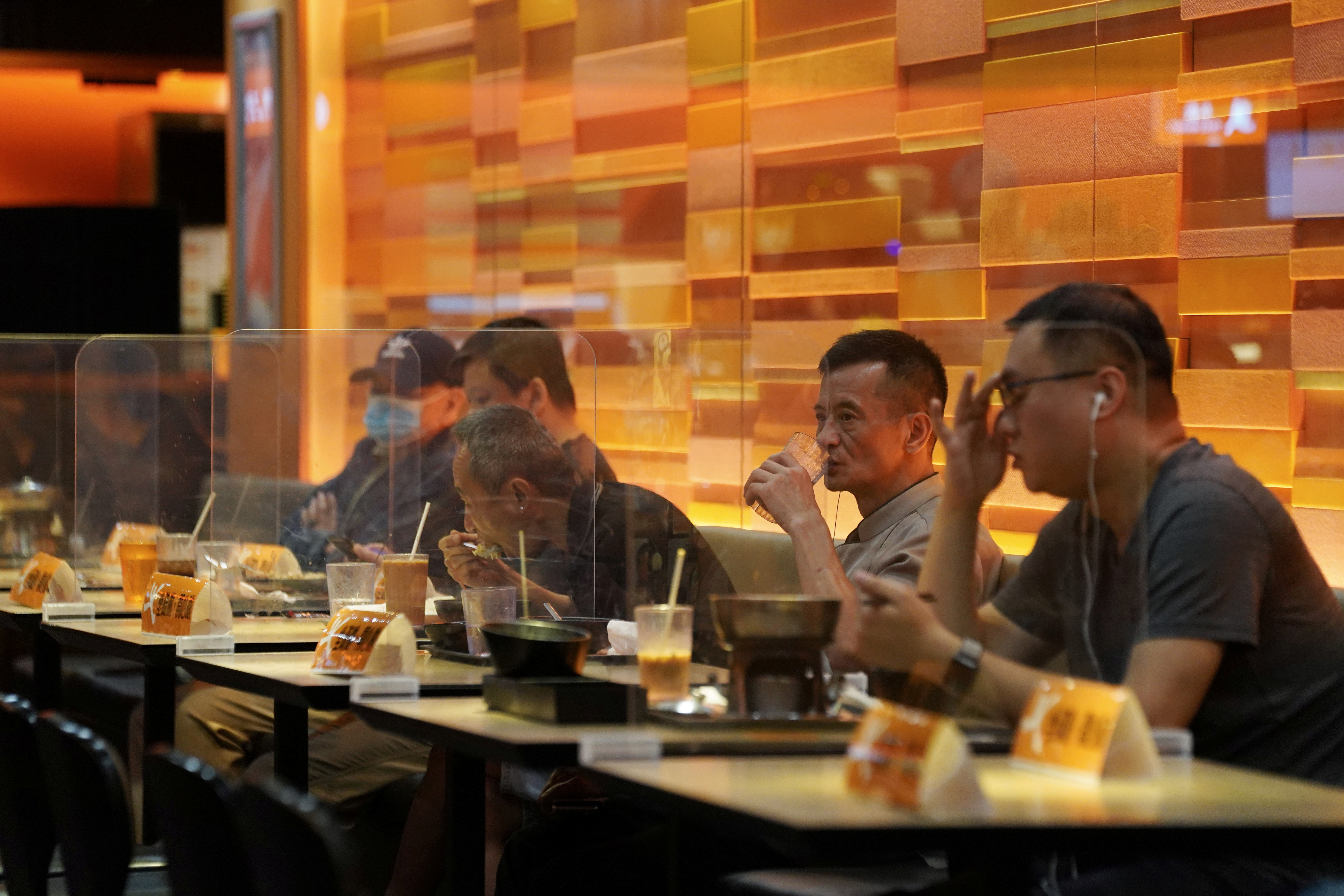 People dine inside a restaurant in Hong Kong