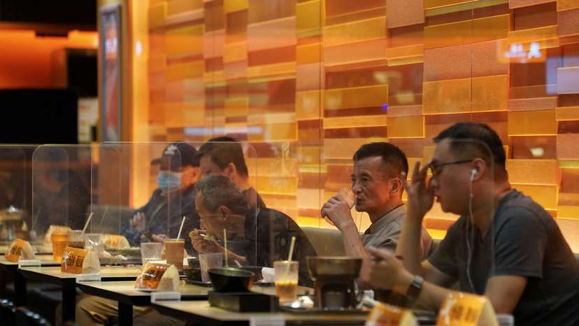 People dine inside a restaurant in Hong Kong