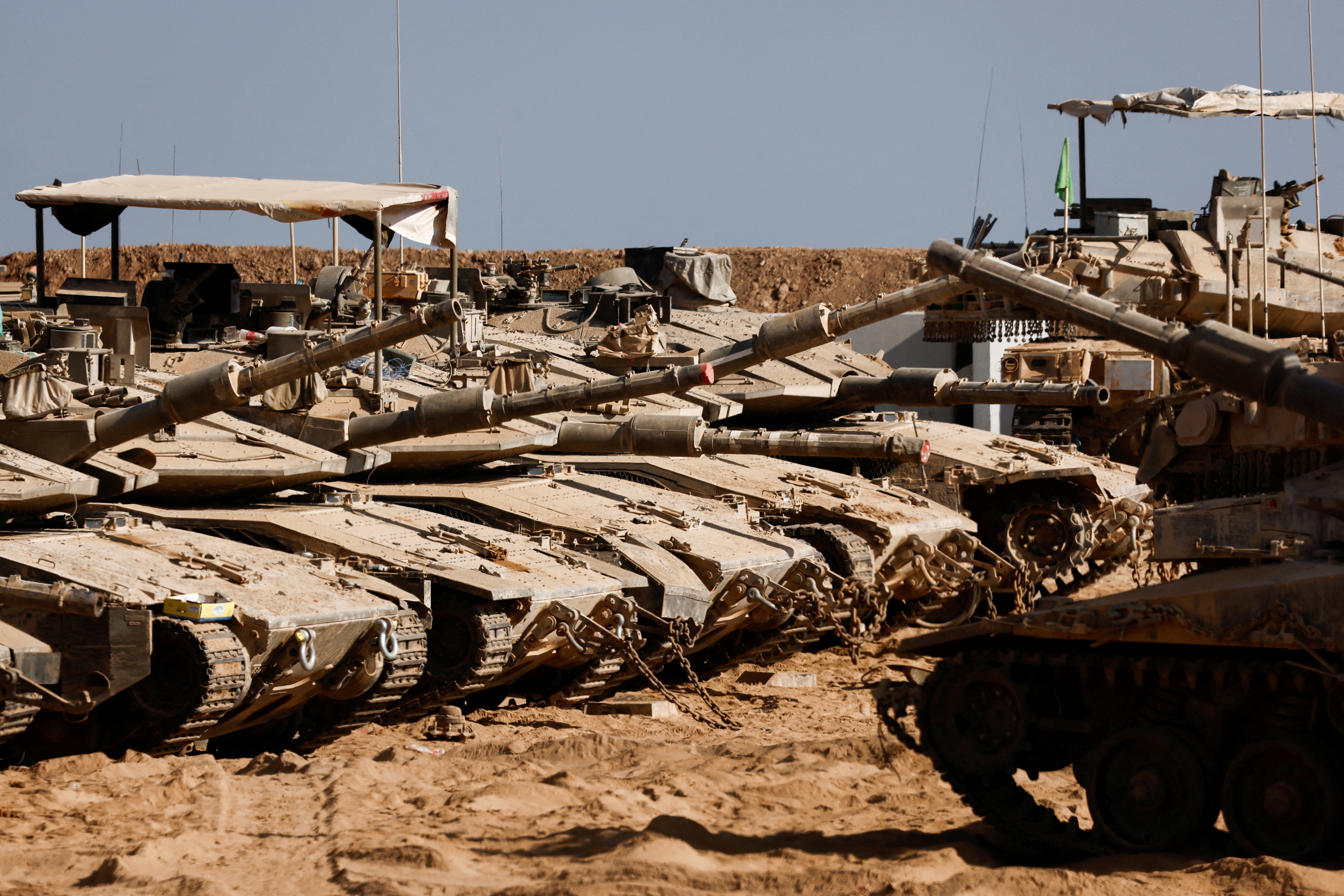 FILE PHOTO: Israeli military vehicles stand near the Israel-Gaza border, in Israel