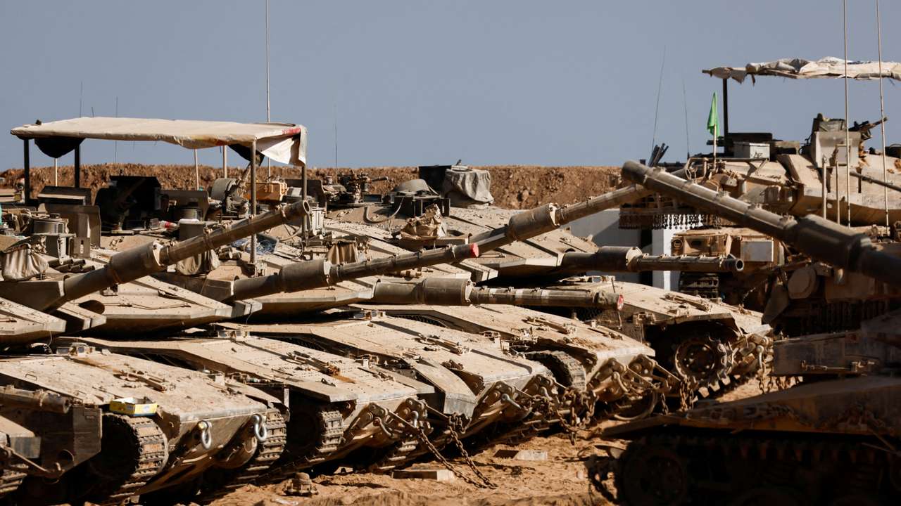 FILE PHOTO: Israeli military vehicles stand near the Israel-Gaza border, in Israel