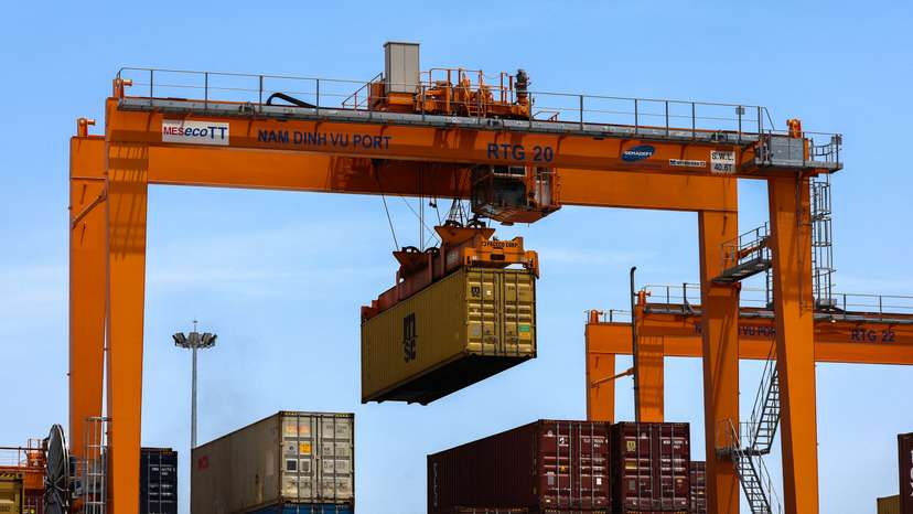 FILE PHOTO: A container is loaded onto a cargo ship while docked at Hai Phong port in Vietnam