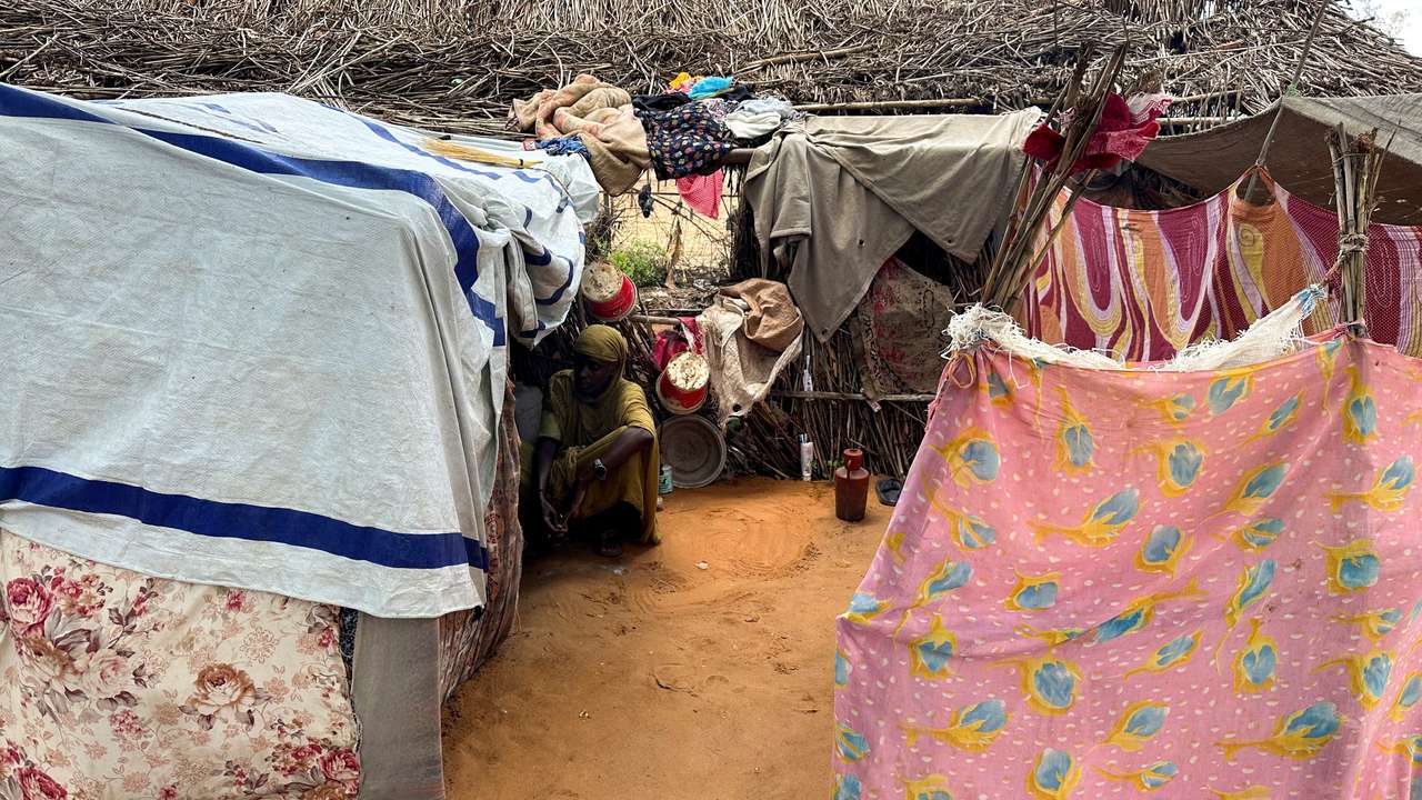 FILE PHOTO: Displaced Sudanese woman rests inside a shelter at Zamzam camp in North Darfur