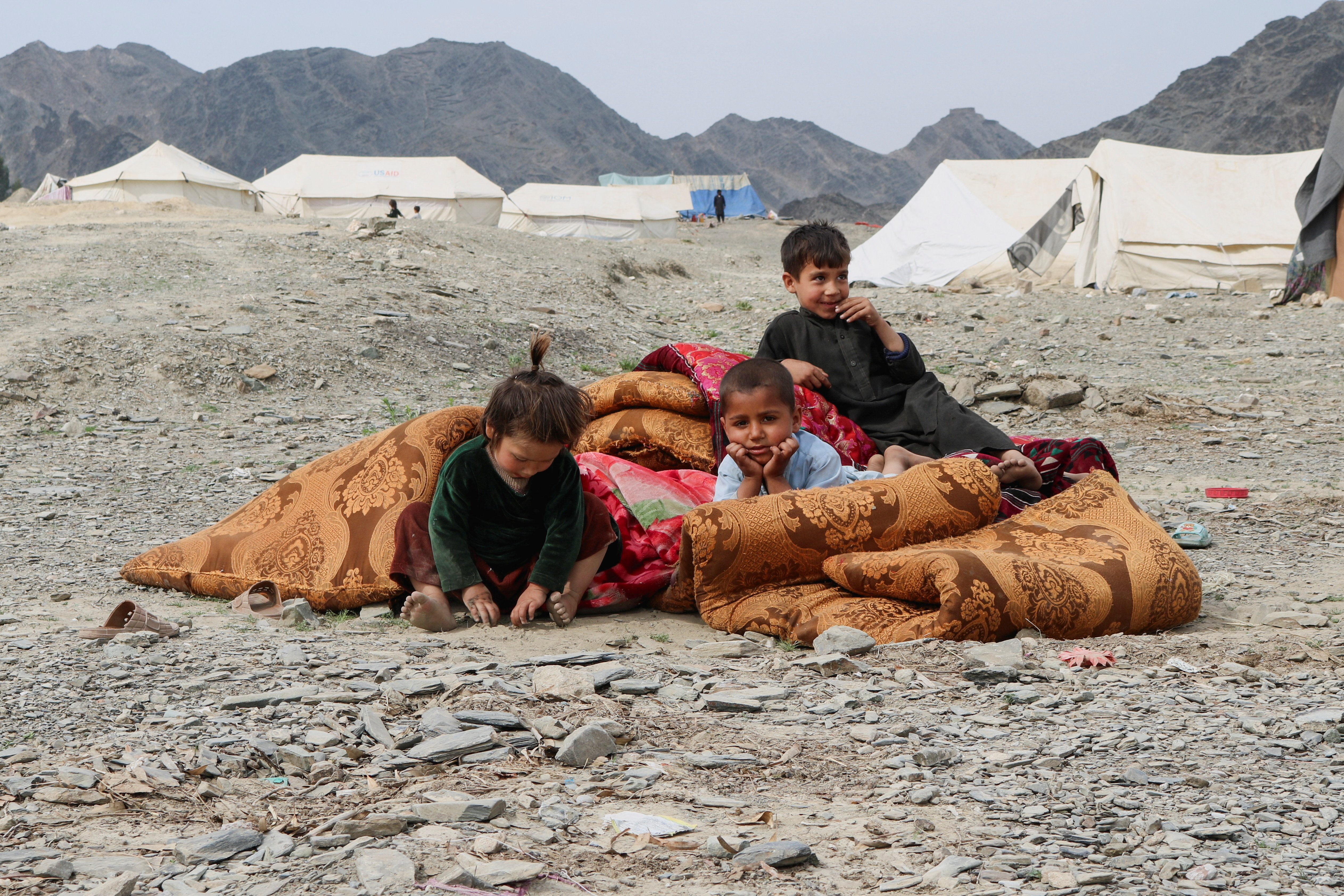 Displaced Afghans take refuge following exchanges of fire between Pakistani and Afghan forces at a border crossing, in Lal Pur