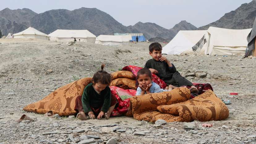 Displaced Afghans take refuge following exchanges of fire between Pakistani and Afghan forces at a border crossing, in Lal Pur
