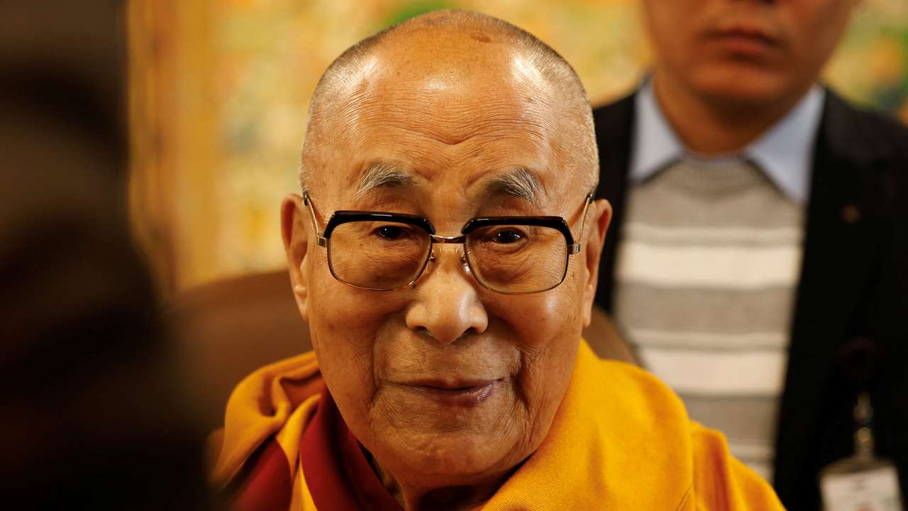 Tibetan spiritual leader, the Dalai Lama, offers blessings to his followers at his Himalayan residence in Dharamshala
