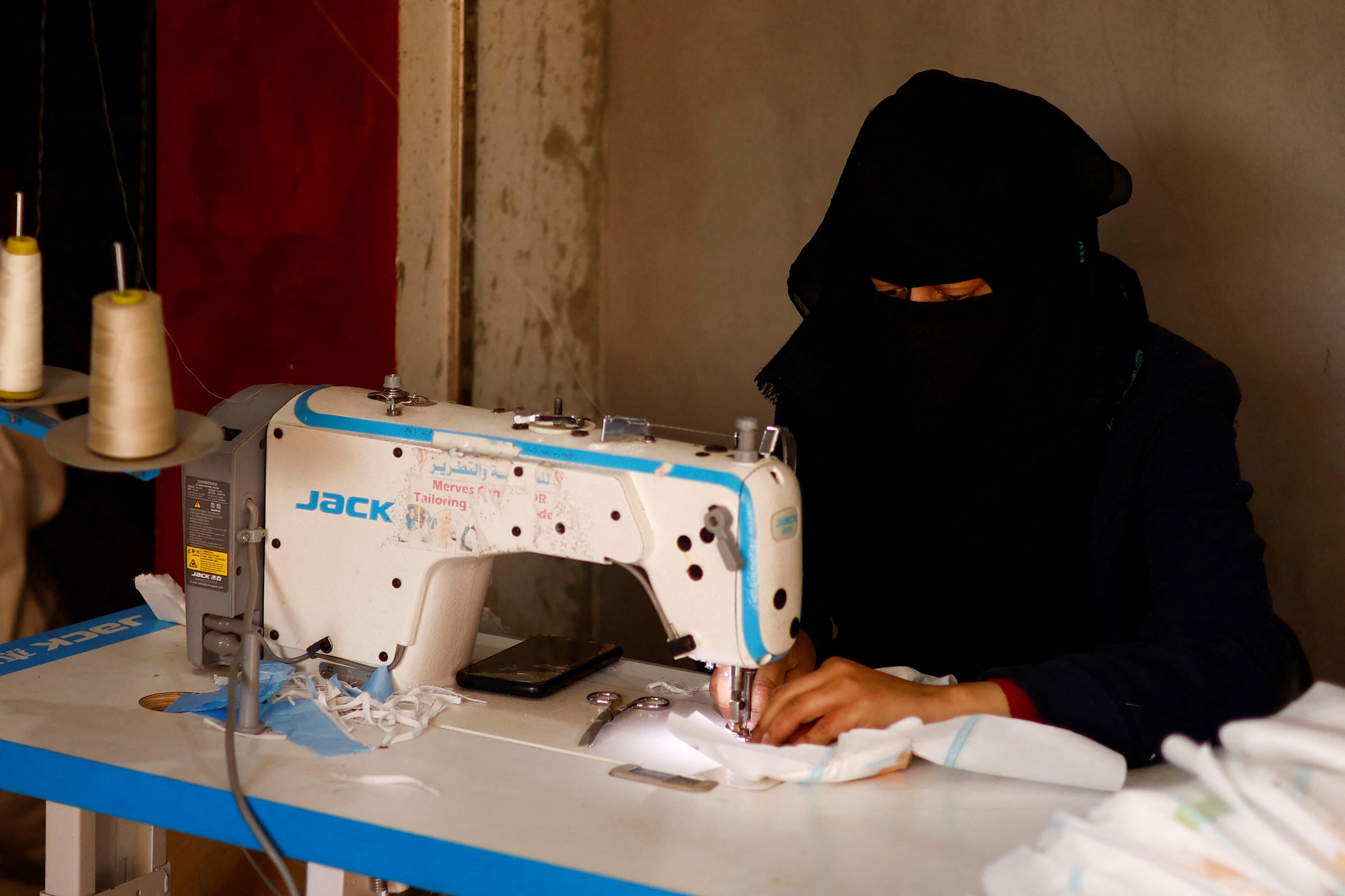 Palestinians sew diapers in a workshop amid scarcity as the conflict between Israel and Hamas continues, in Rafah
