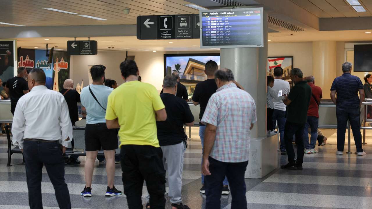 FILE PHOTO: People stand at Beirut-Rafic Hariri International Airport, in Beirut
