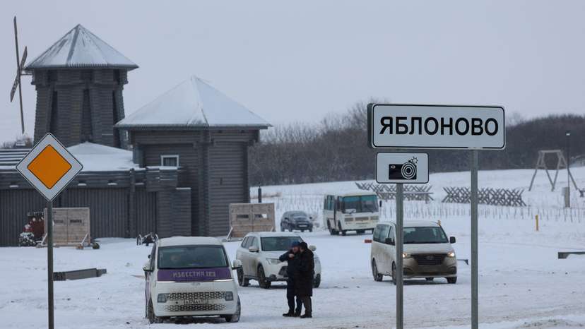 Vehicles are parked next to road near Russian Il-76 military plane crash site in Belgorod region