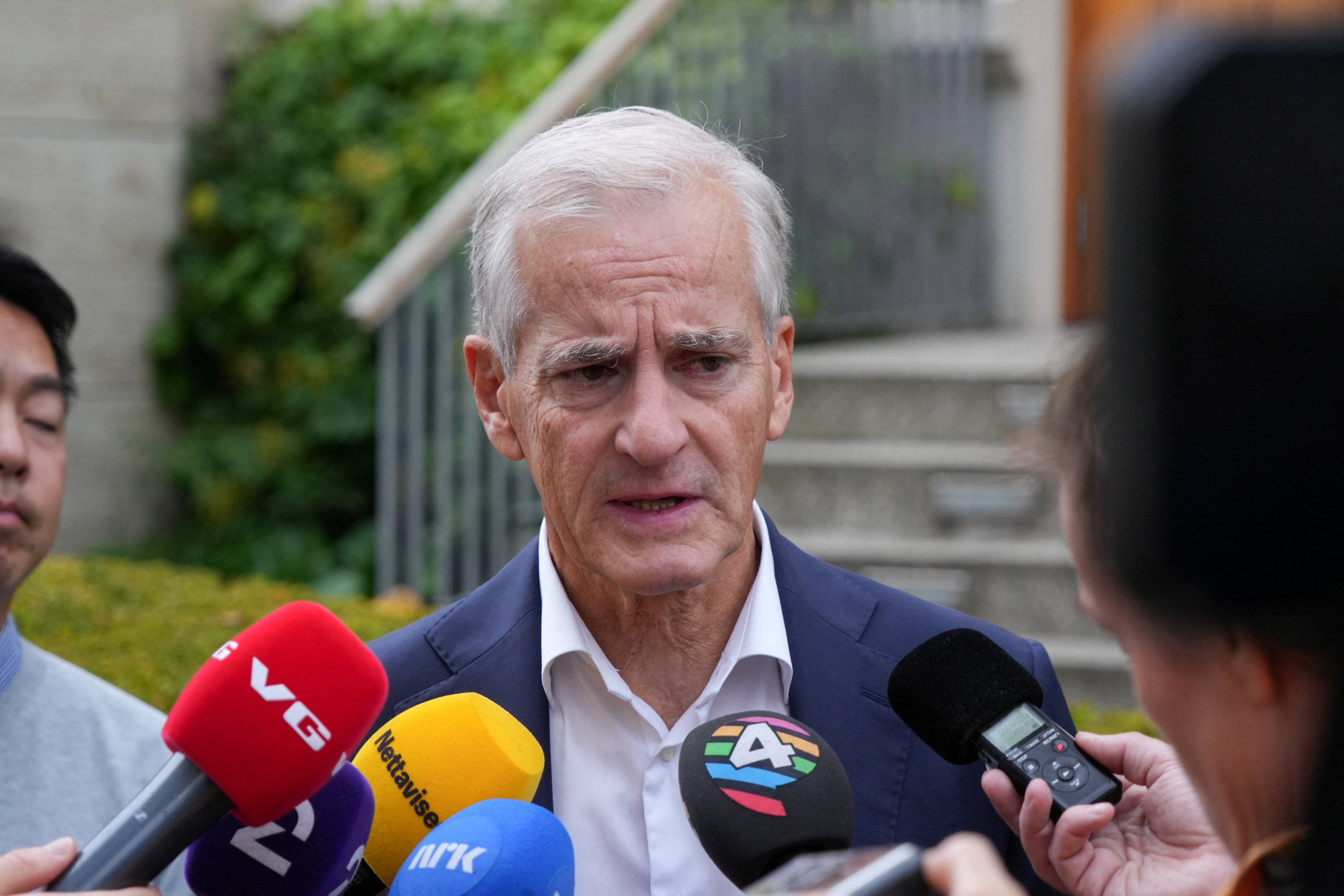 Norwegian re-elected PM Stoere talks to media in Oslo