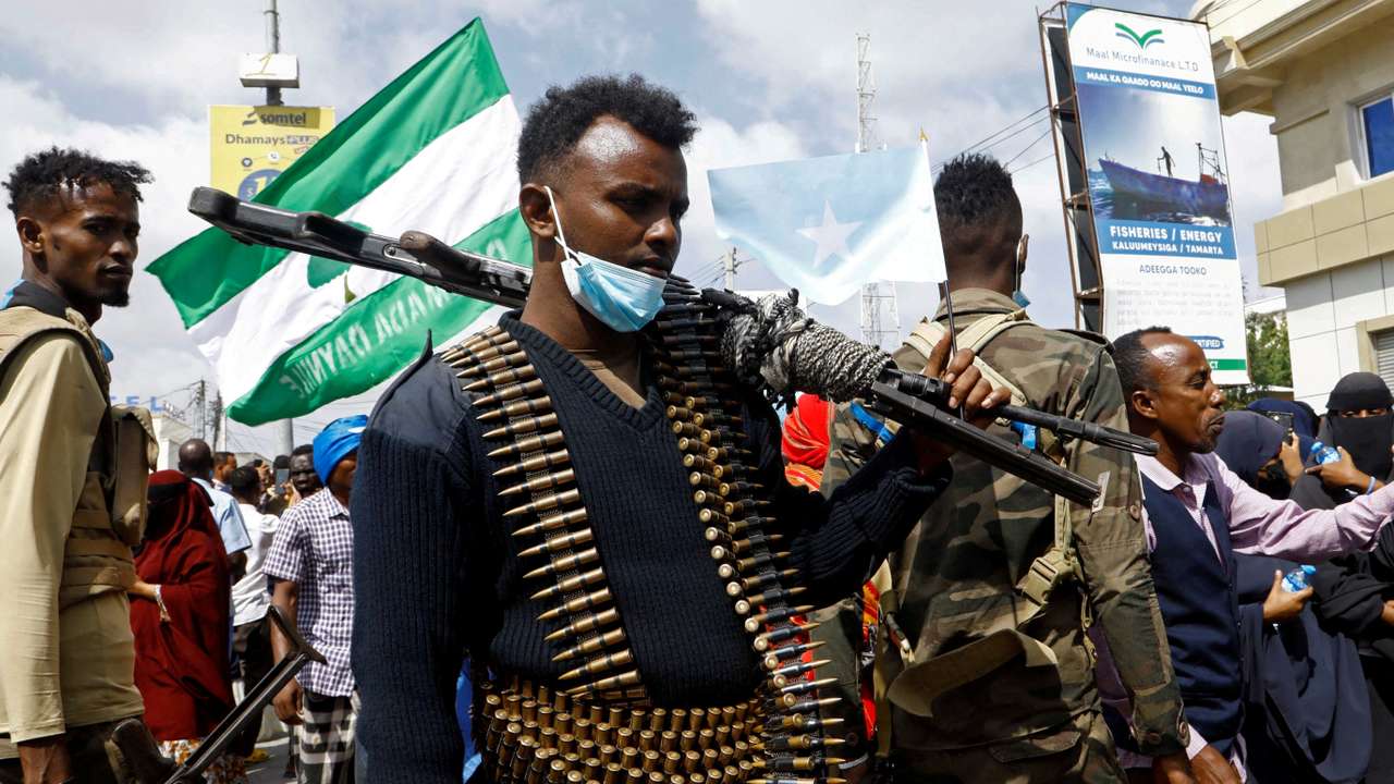 FILE PHOTO: A Somali police officers stands guard during a march against the Ethiopia-Somaliland port deal along KM4 street in Mogadishu
