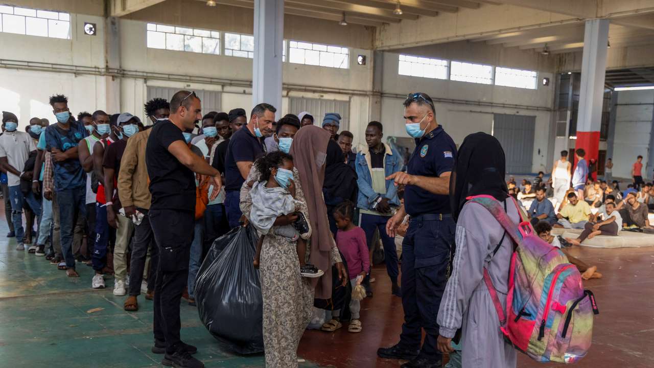 Newly-arrived migrants prepare to depart to mainland Greece, from Crete island