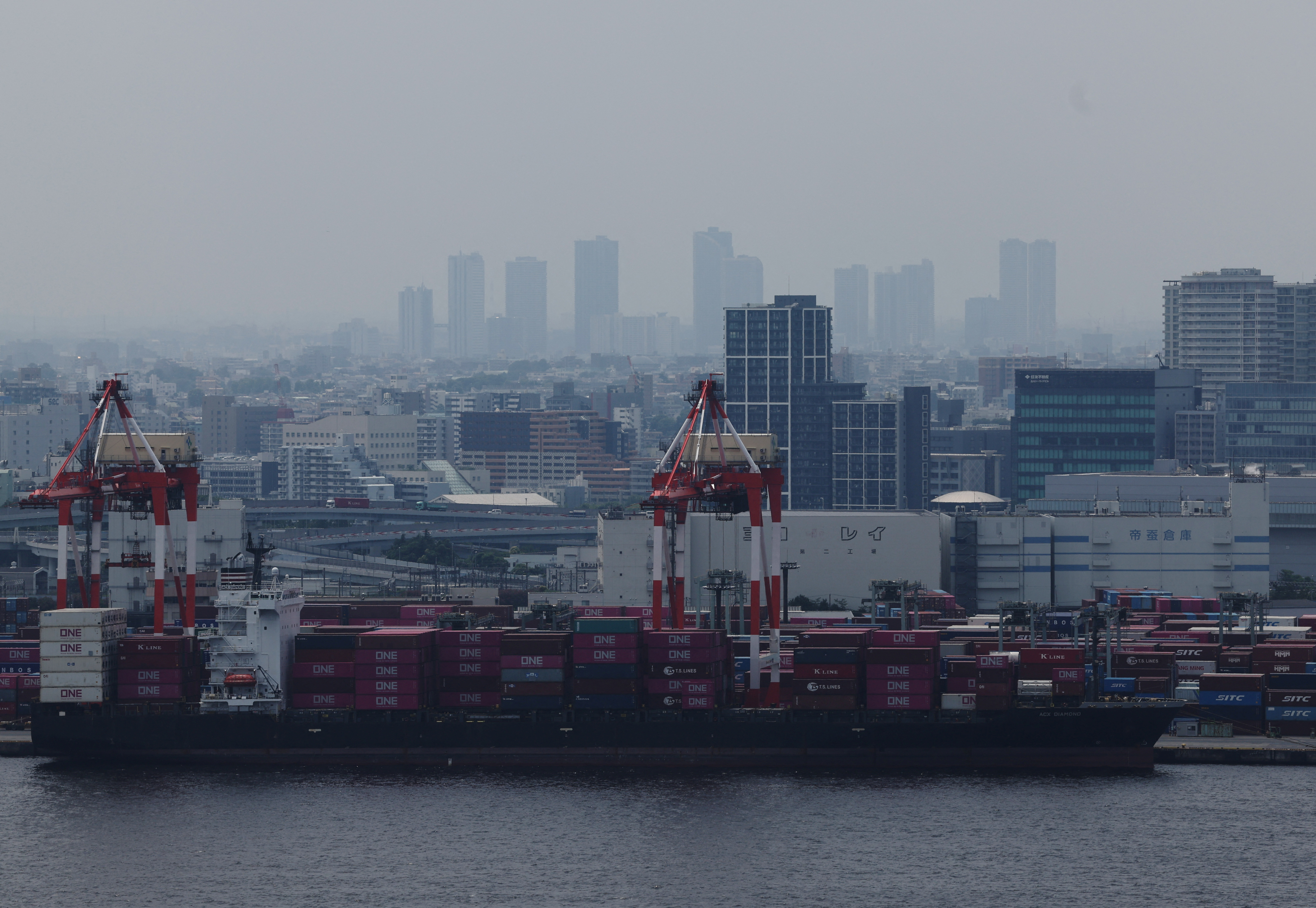 Containers are pictured at an industrial port in Tokyo