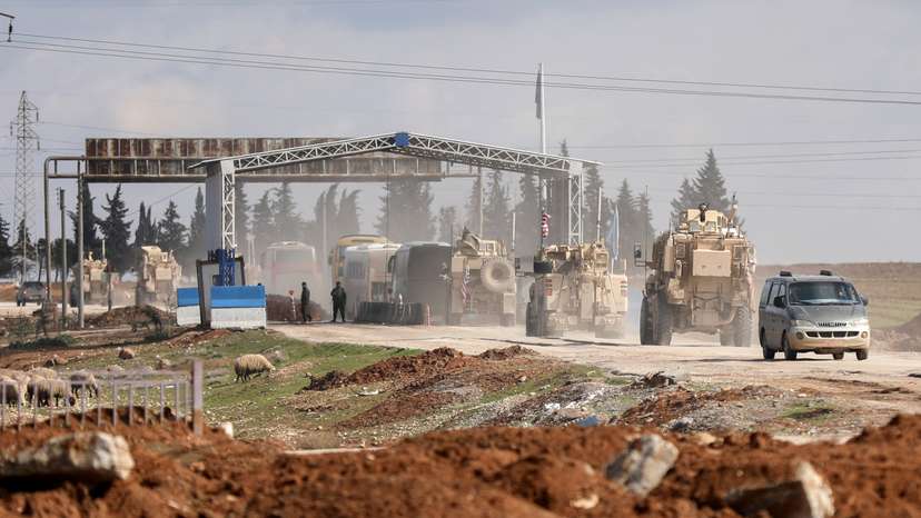 Islamic State detainees head from Syria towards Iraq, in Qamishli