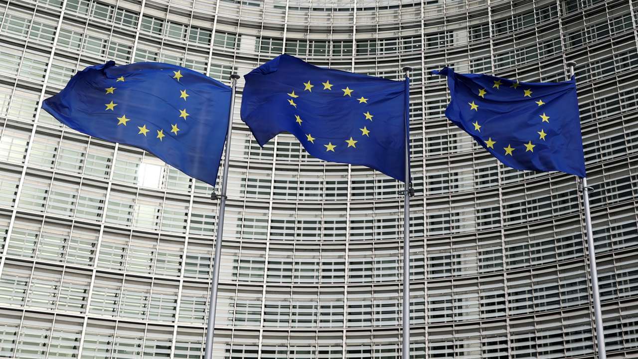 EU flags fly outside the European Commission in Brussels