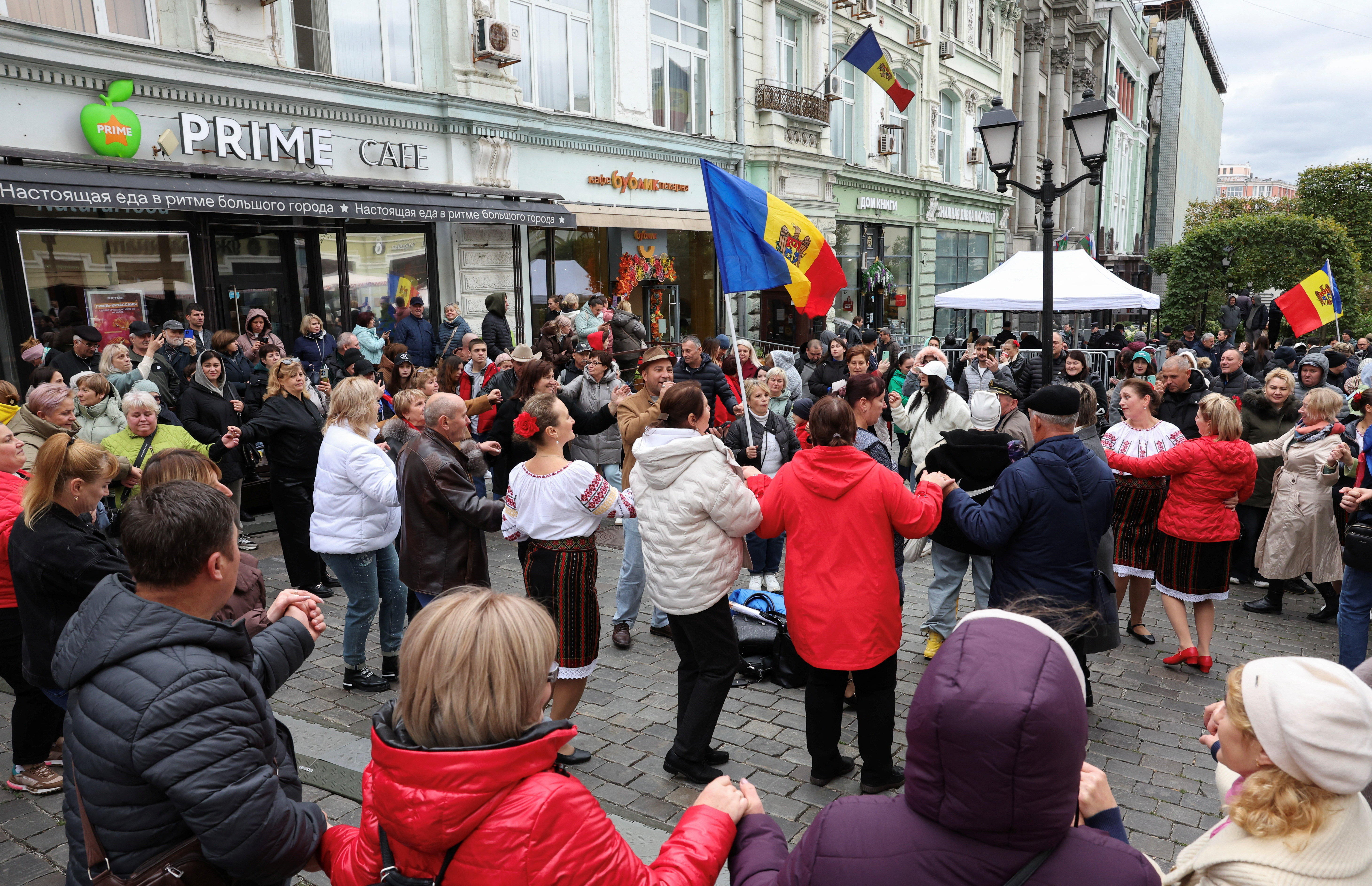 Moldovan citizens queue to vote in the parliamentary elections at the country's embassy in Moscow