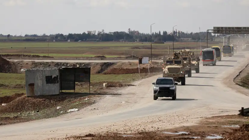FILE PHOTO: Islamic State detainees head from Syria towards Iraq, in Qamishli