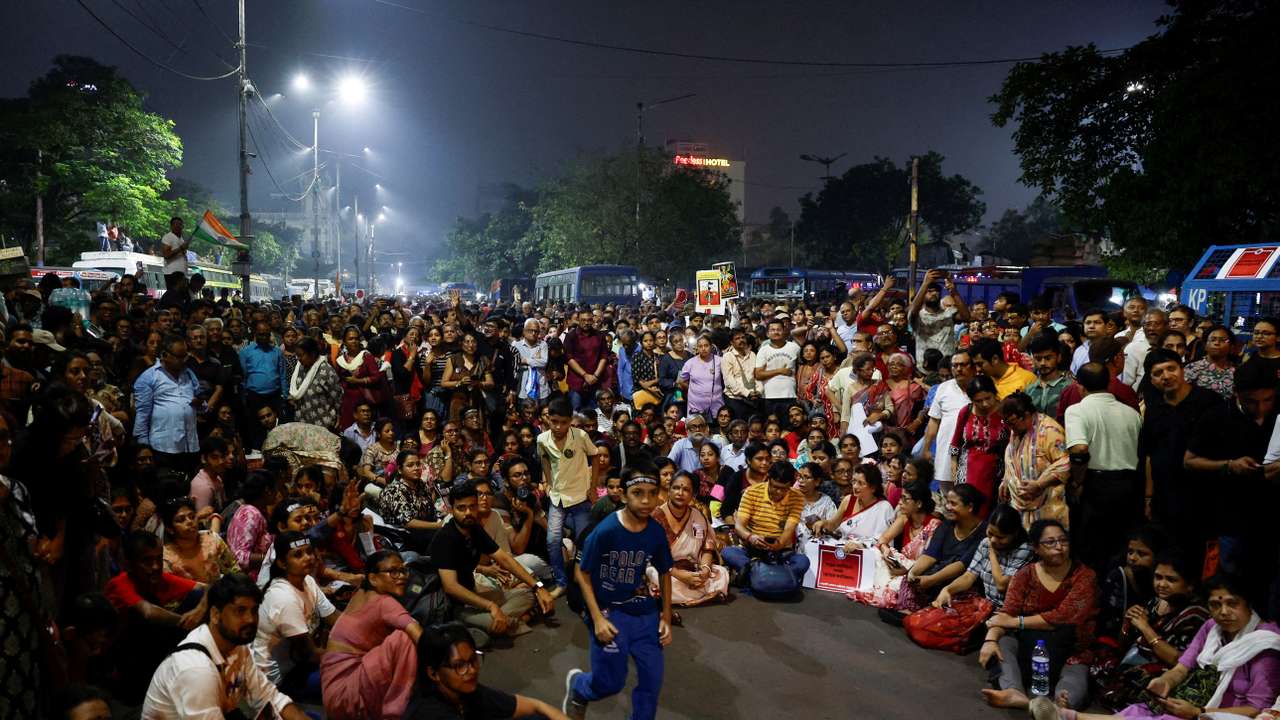 People take part in a protest condemning the rape and murder of a trainee medic at a government-run hospital, in Kolkata