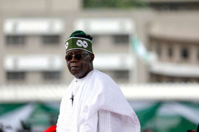 FILE PHOTO: FILE PHOTO: Nigeria's President Bola Tinubu looks on after his swearing-in ceremony in Abuja