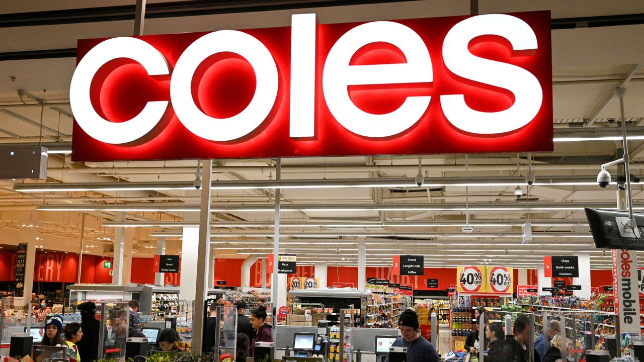 FILE PHOTO: FILE PHOTO: Customers seen in the self-service checkout area of a Coles supermarket in Sydney, Australia