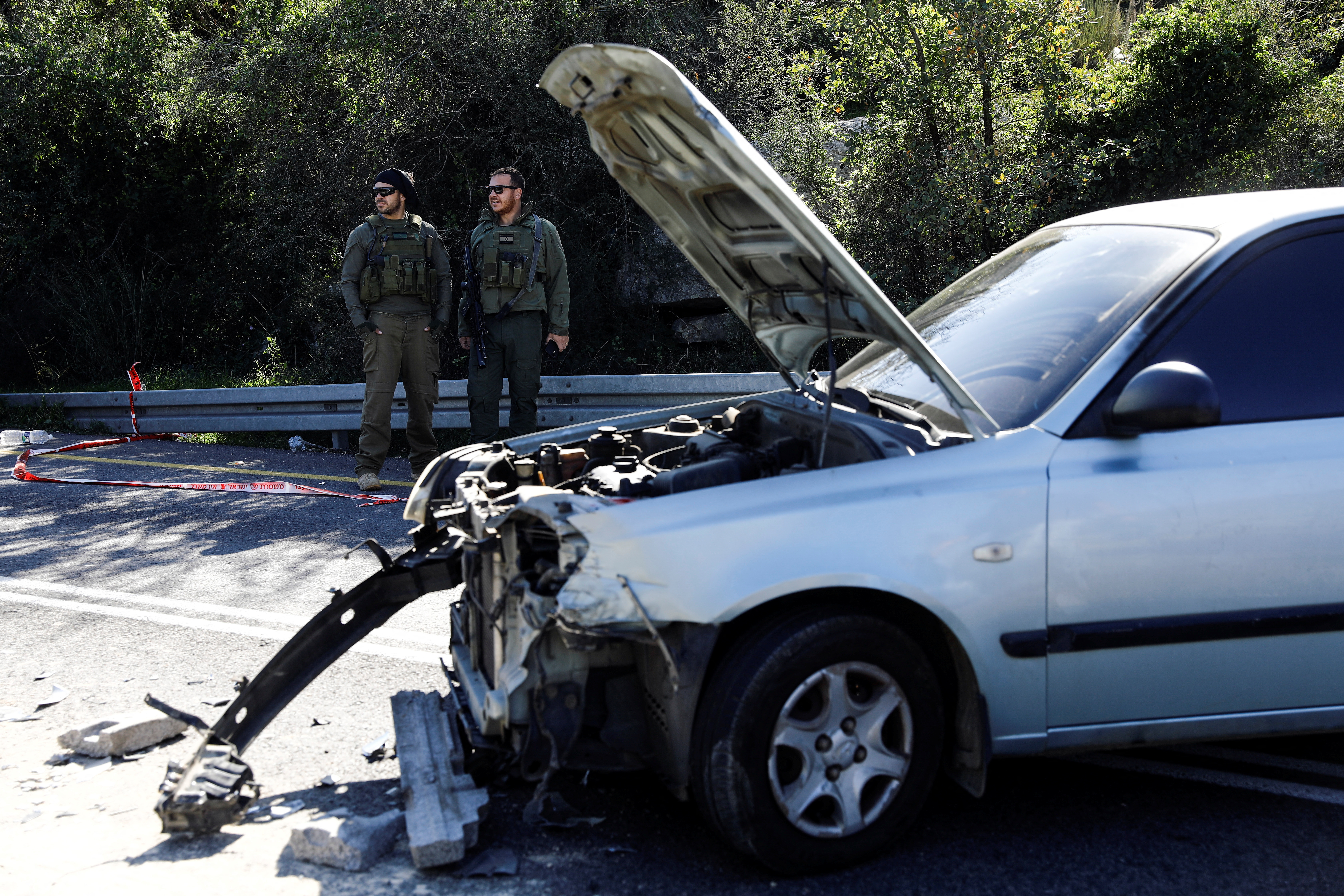 Israeli security forces gather at the site of a deadly shooting near Ramallah