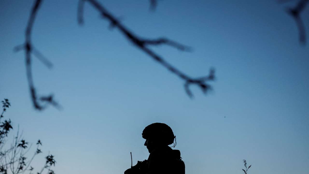 Ukrainian service members attend military drills near a frontline in Donetsk region