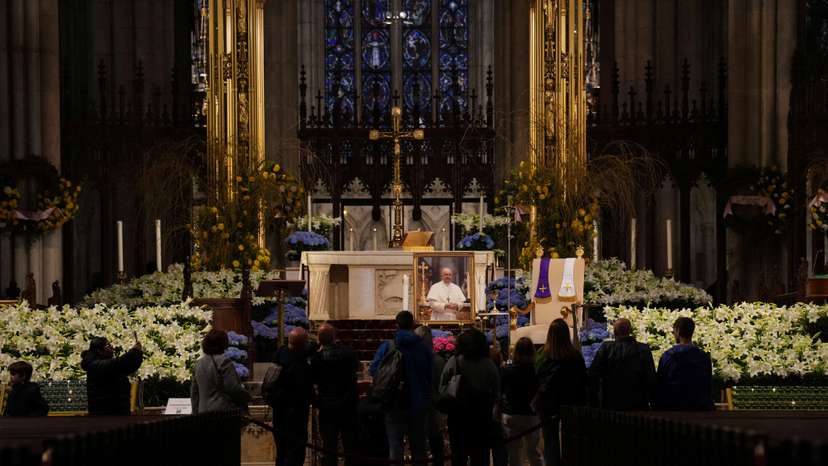 A photo of Pope Francis is kept on display as people pay their respects, after the death of Pope Francis was announced by the Vatican, at St Patrick's Cathedral in Manhattan