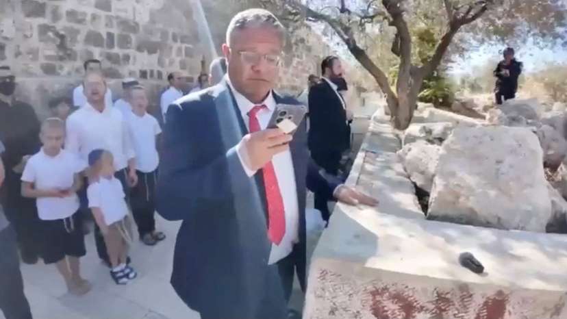 A screengrab from a video shows Israeli National Security Minister Itamar Ben-Gvir as he prays at the Al-Aqsa Mosque compound during the Jewish holiday of Sukkot
