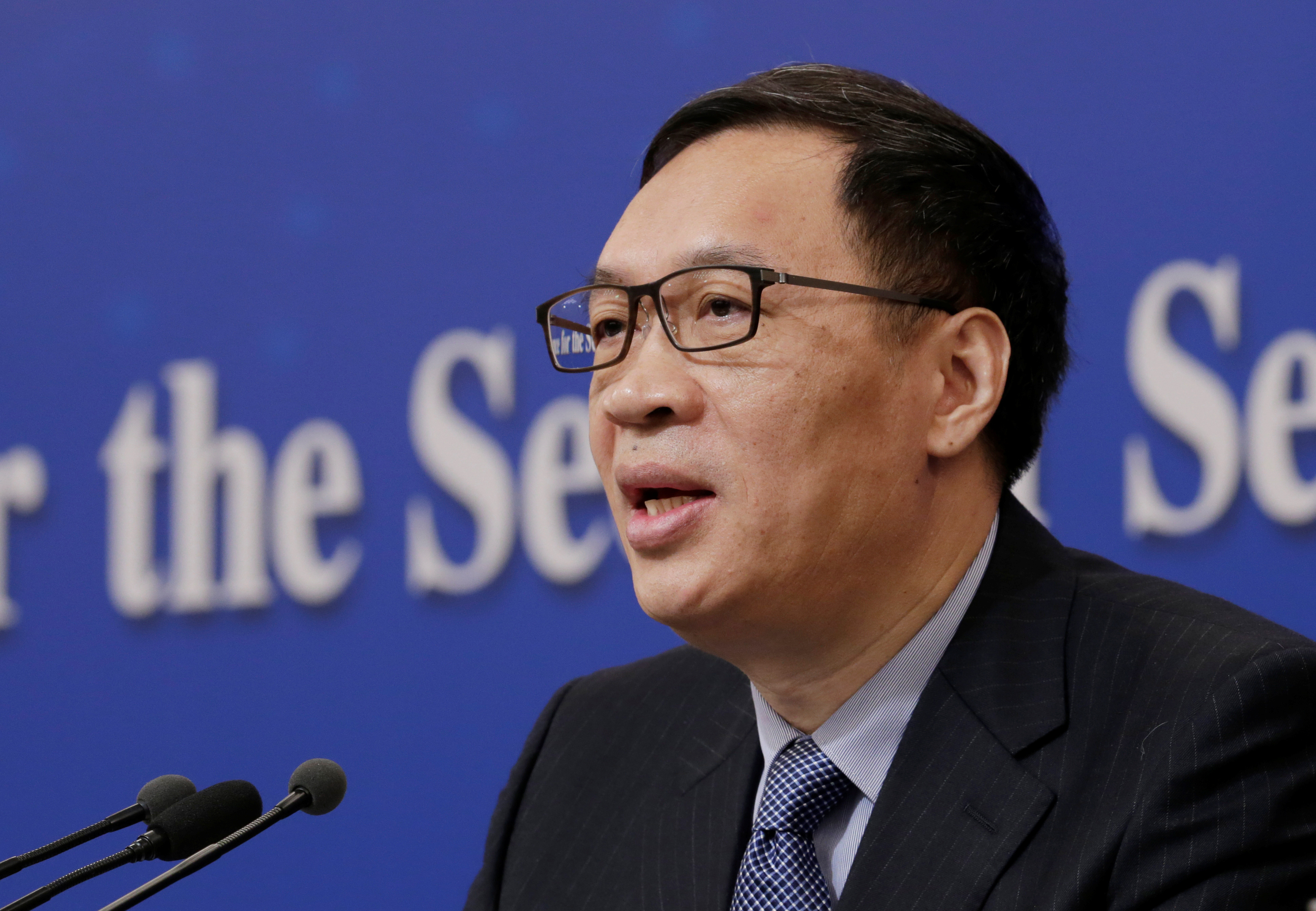 Fan Yifei, vice governor of the PBOC, attends a news conference during ongoing session of the NPC in Beijing