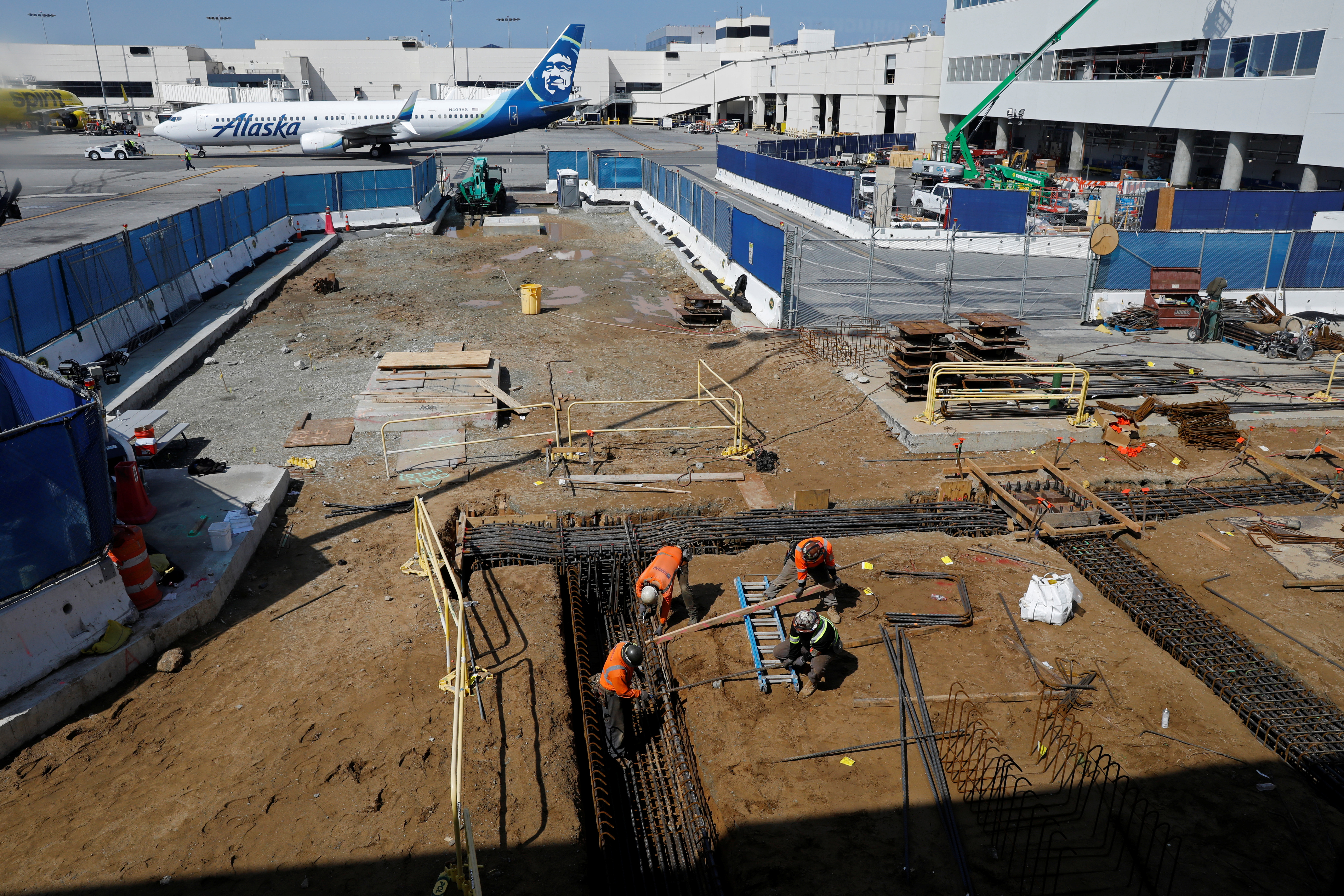FILE PHOTO: Workers at a construction site at Los Angeles International Airport (LAX)