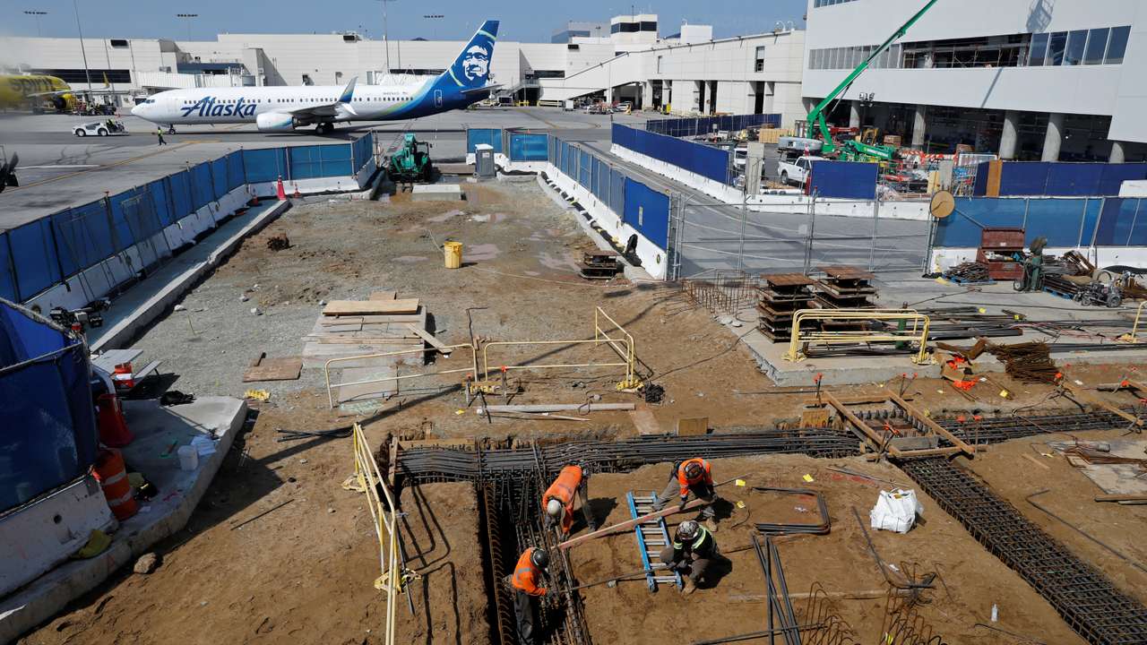 FILE PHOTO: Workers at a construction site at Los Angeles International Airport (LAX)